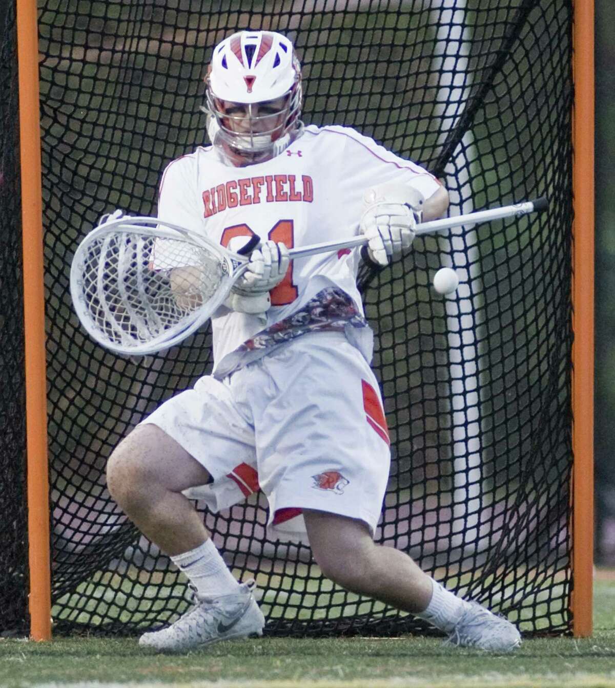 Ridgefield High School goaltender Daniel Parson tries for the save in a game against New Canaan High School, played at Ridgefield. Wednesday, May 17, 2017