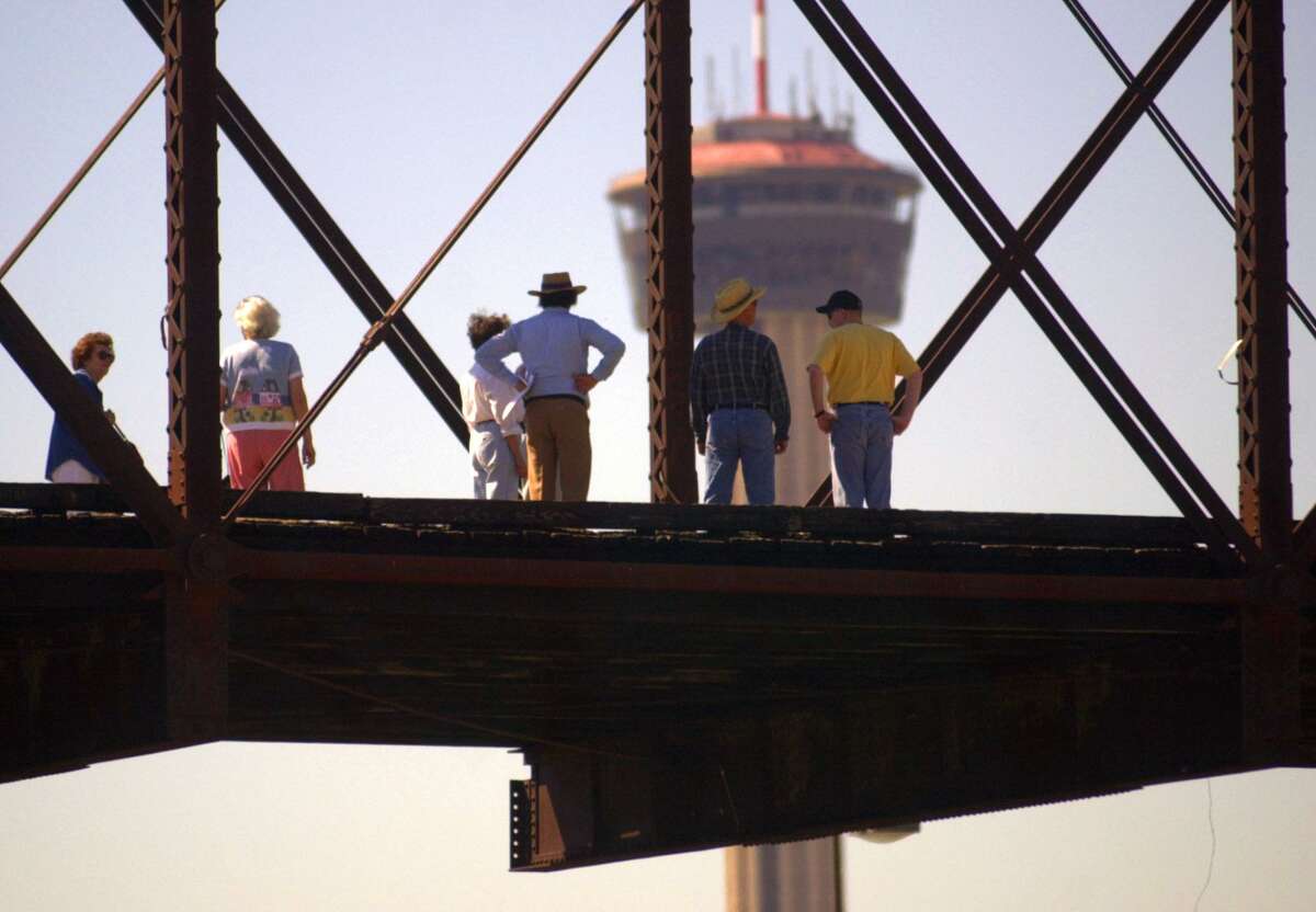 Members of an Ad Hoc committee formed to look at preserving the Hays Street Bridge walk across the near-downtown structure Friday morning Sept. 29, 2000.