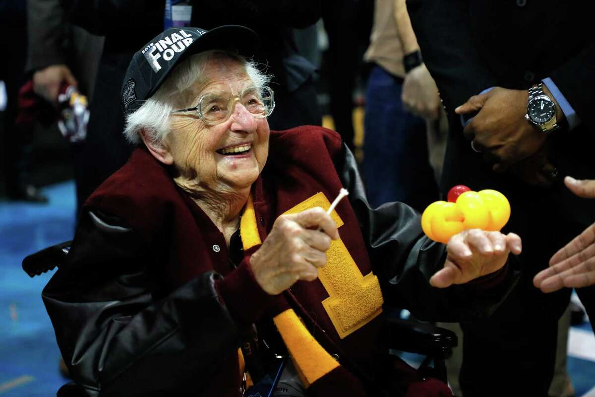 ATLANTA, GA - MARCH 24: Sister Jean Dolores Schmidt celebrates with the Loyola Ramblers after defeating the Kansas State Wildcats during the 2018 NCAA Men's Basketball Tournament South Regional at Philips Arena on March 24, 2018 in Atlanta, Georgia. Loyola defeated Kansas State 78-62.