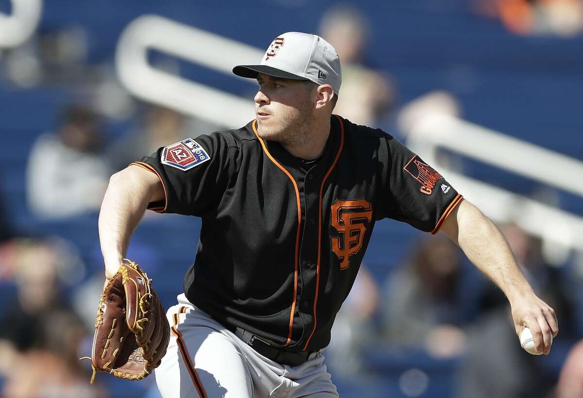 San Francisco Giants pitcher Ty Blach throws during the first inning of a spring training baseball game against the Milwaukee Brewers, Wednesday, Feb. 28, 2018, in Maryvale, Ariz. (AP Photo/Carlos Osorio)