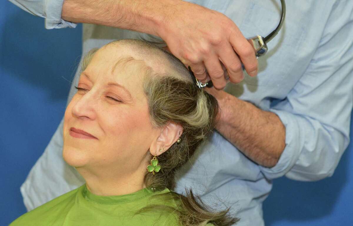 Bette Blackwell from Bridgeport returns to get her hair cut for the 12th year in a row at the TeamBrent St. Baldrick’s Foundation head shaving celebration at the Westport Family YMCA on Sunday March 25, 2018, in Westport Conn. This is the 14th year of the event and they have raised over four million dollars for childhood cancer research for the St. Badlrick’s Foundation.