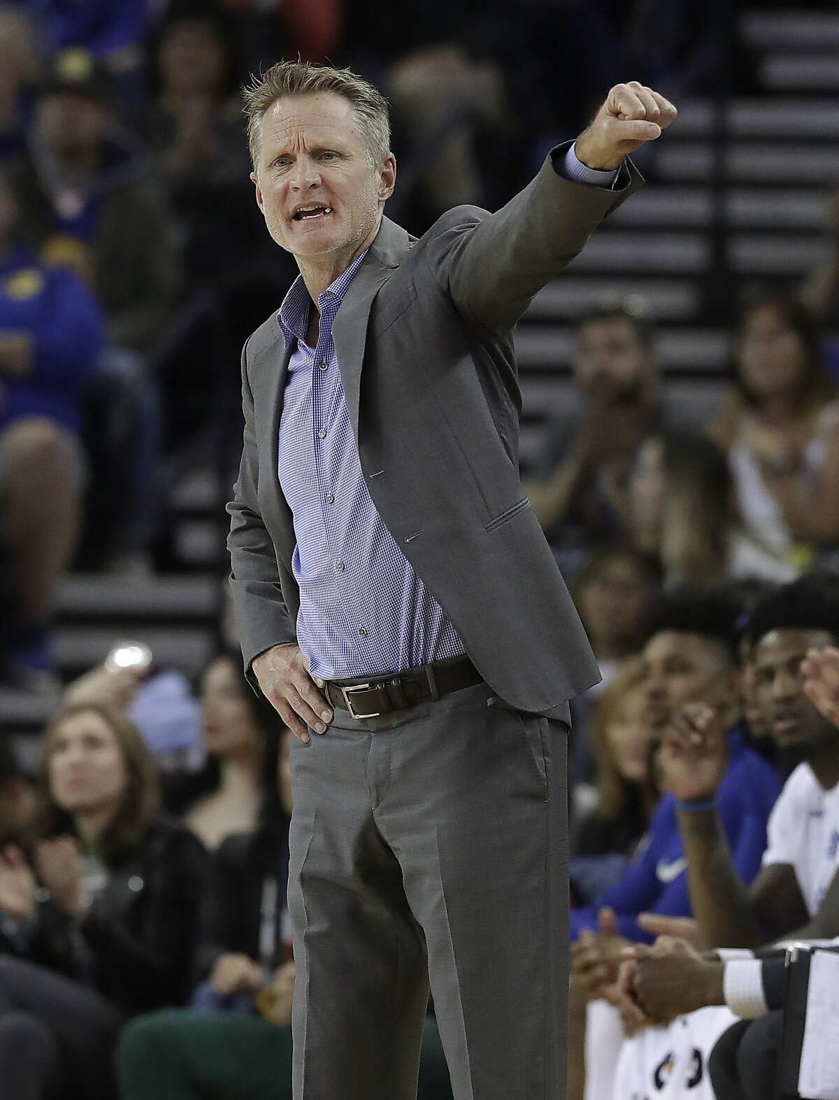 Golden State Warriors coach Steve Kerr gestures during the first half of his team's NBA basketball game against the Atlanta Hawks in Oakland, Calif., Friday, March 23, 2018. (AP Photo/Jeff Chiu)