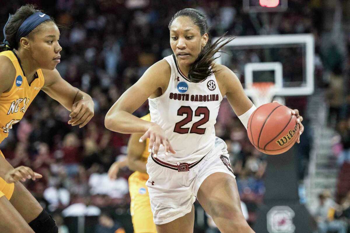 South Carolina forward A'ja Wilson, right, drives to the hoop against North Carolina A&T forward Alexus Lessears, left, during the second half of a game in the first-round of the NCAA women's college basketball tournament, Friday, March 16, 2018, in Columbia, S.C. South Carolina defeated North Carolina A&T 63-52. (AP Photo/Sean Rayford)