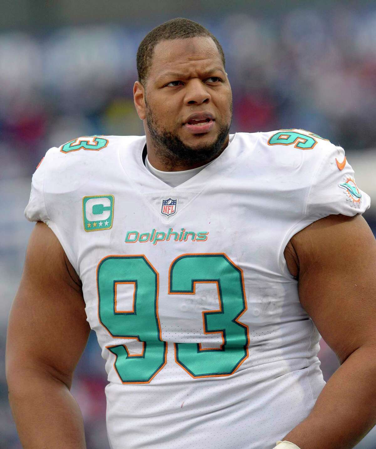 FILE - In this Dec. 17, 2017, file photo, Miami Dolphins defensive tackle Ndamukong Suh (93) looks on from the sideline during the first half of an NFL football game against the Buffalo Bills, in Orchard Park, N.Y. The Miami Dolphins appear ready to move on without their defensive anchor. Miami is discussing releasing five-time Pro Bowl tackle Ndamukong Suh when the NFL's new year begins Wednesday, a person familiar with the situation said Monday, March 12, 2018. The person said nothing has been finalized, and confirmed the conversations to The Associated Press on condition of anonymity because the Dolphins have not commented. (AP Photo/Adrian Kraus, File)