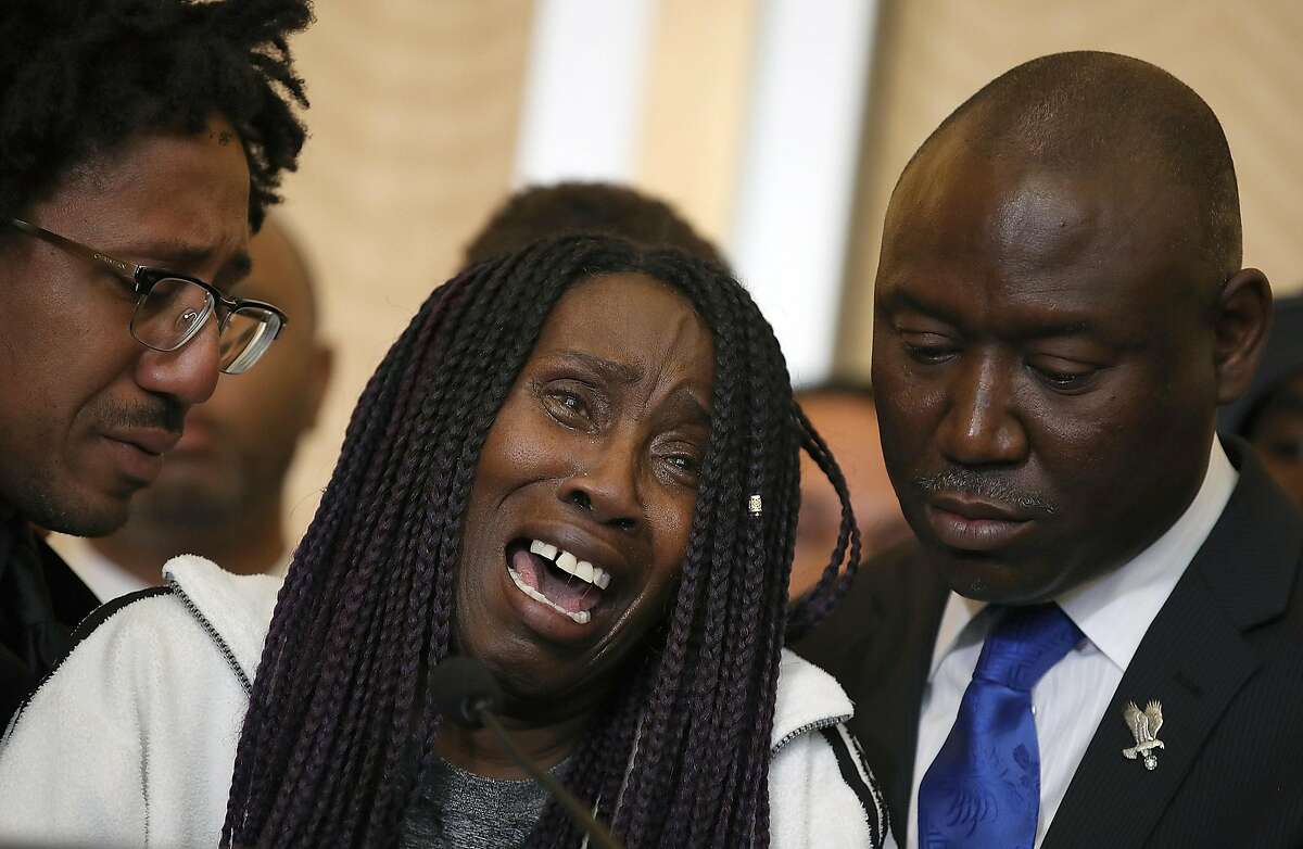 SACRAMENTO, CA - MARCH 26: Sequita Thompson, (C) grandmother of Stephon Clark who was shot and killed by Sacramento police, cries during a news conference with civil rights attorney Ben Crump on March 26, 2018 in Sacramento, California. The family of Stephon Clark, an unarmed black man who was shot and killed by Sacramento police officers, have hired civil rights attorney Ben Crump to represent the Clark family in a wrongful death suit against the Sacramento police department. (Photo by Justin Sullivan/Getty Images) *** BESTPIX ***
