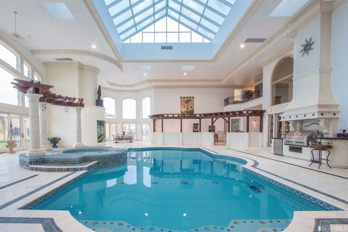 The home of the future may not have a sizable indoor pool like this property, but surveys show that more people will be incorporating wellness-facility amenities into their new homes in 2021. It's among the trends this year's pandemic has kicked into motion.