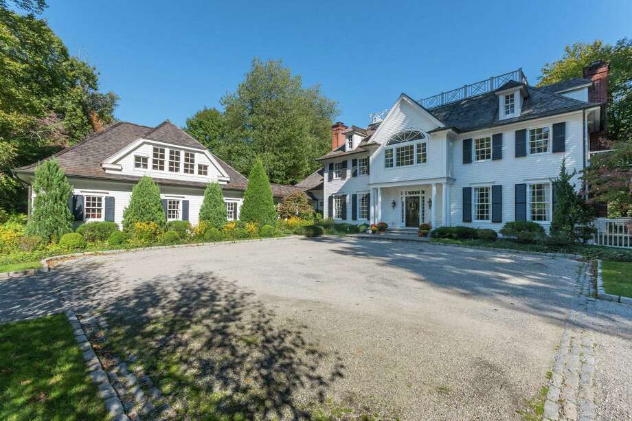 The colonial house at 38 Three Wells Lane was thoughtfully designed and contains 12 rooms and 7,149 square feet of living space.