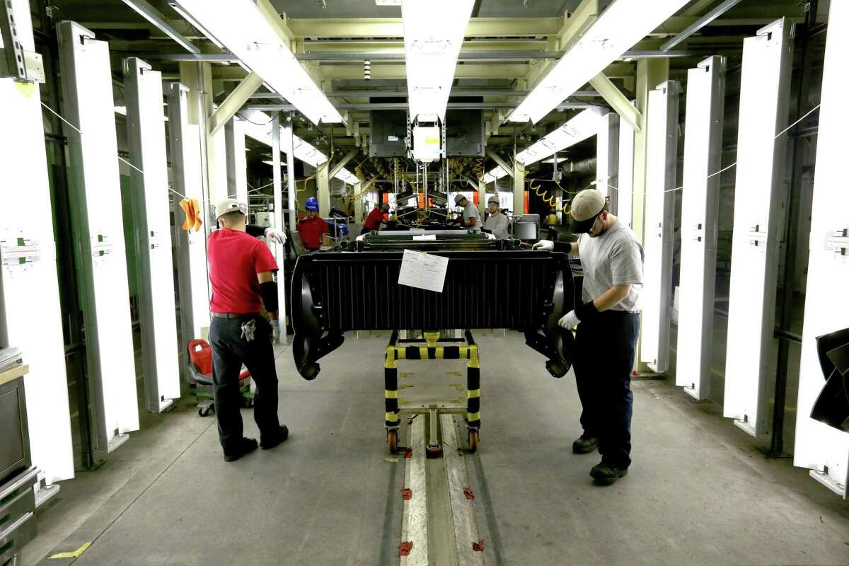 Forma Automotive employees work Thursday Nov. 12, 2015 at a post-assembly inspection point before delivering a truck bed to Toyota. Santana is Toyota's first Hispanic woman-owned direct supplier. Her company supplies Toyota Motor Manufacturing Texas with assembled Tacoma truck beds.