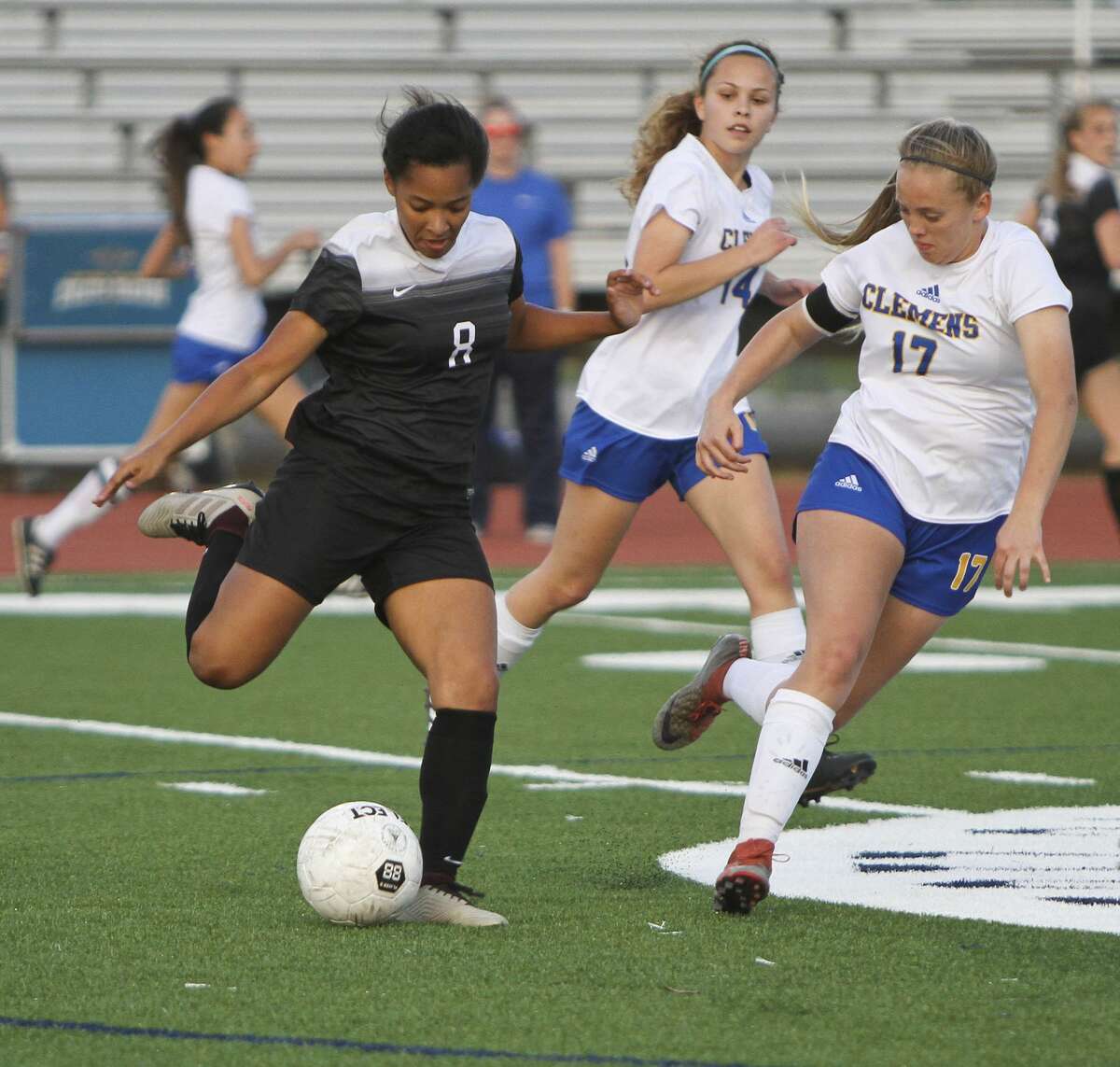 Steele's Ariana Nelson (8) prepares to send the ball downfield past Clemens' Emily Newton (17) and Alex Rudd (14) during Steele's 2-1 win Friday at Lehnhoff Stadium.