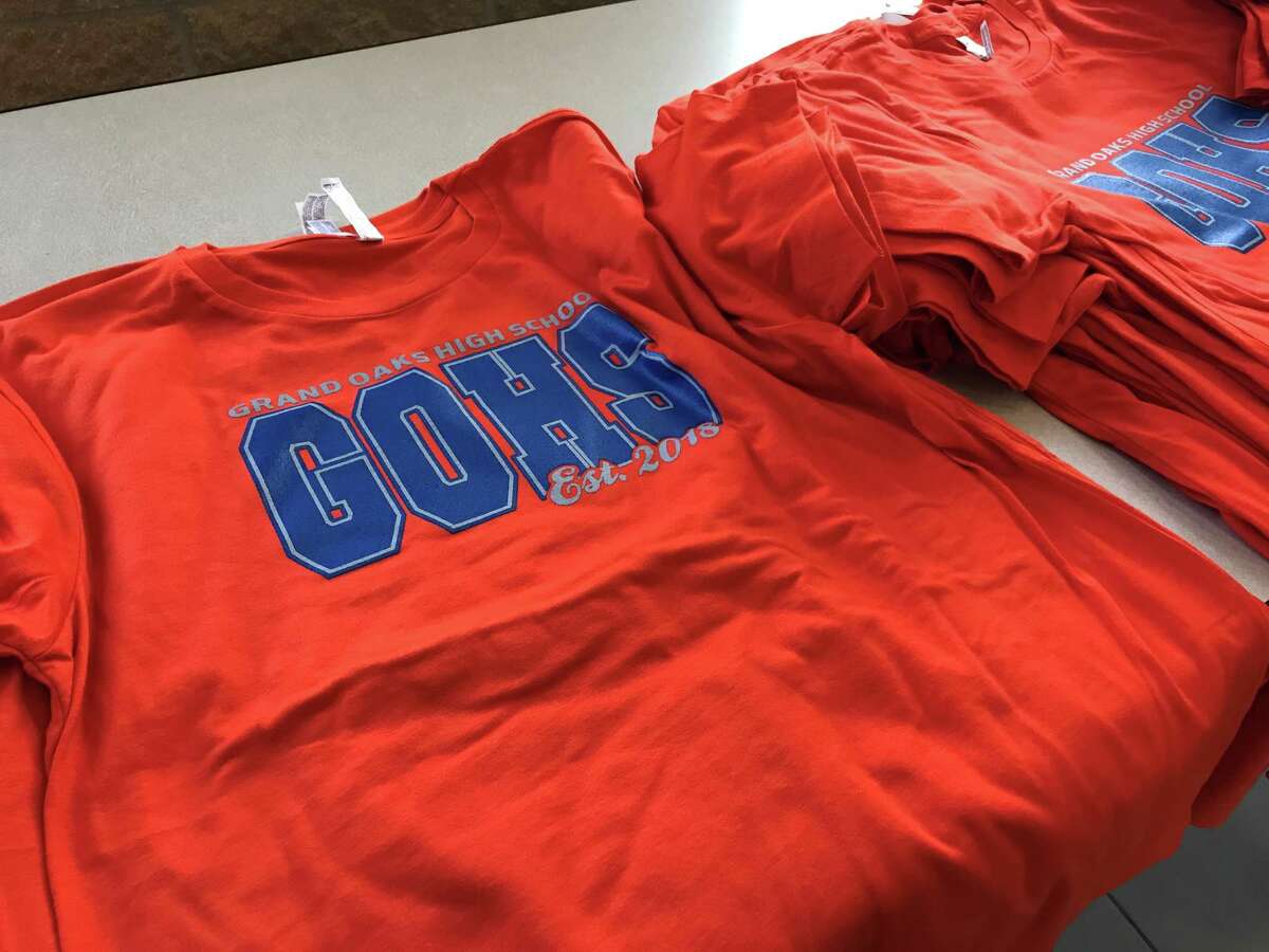 New Grand Oaks High School shirts were available for students and parents during a special athletics event introducing more than a dozen head coaches on Monday evening.