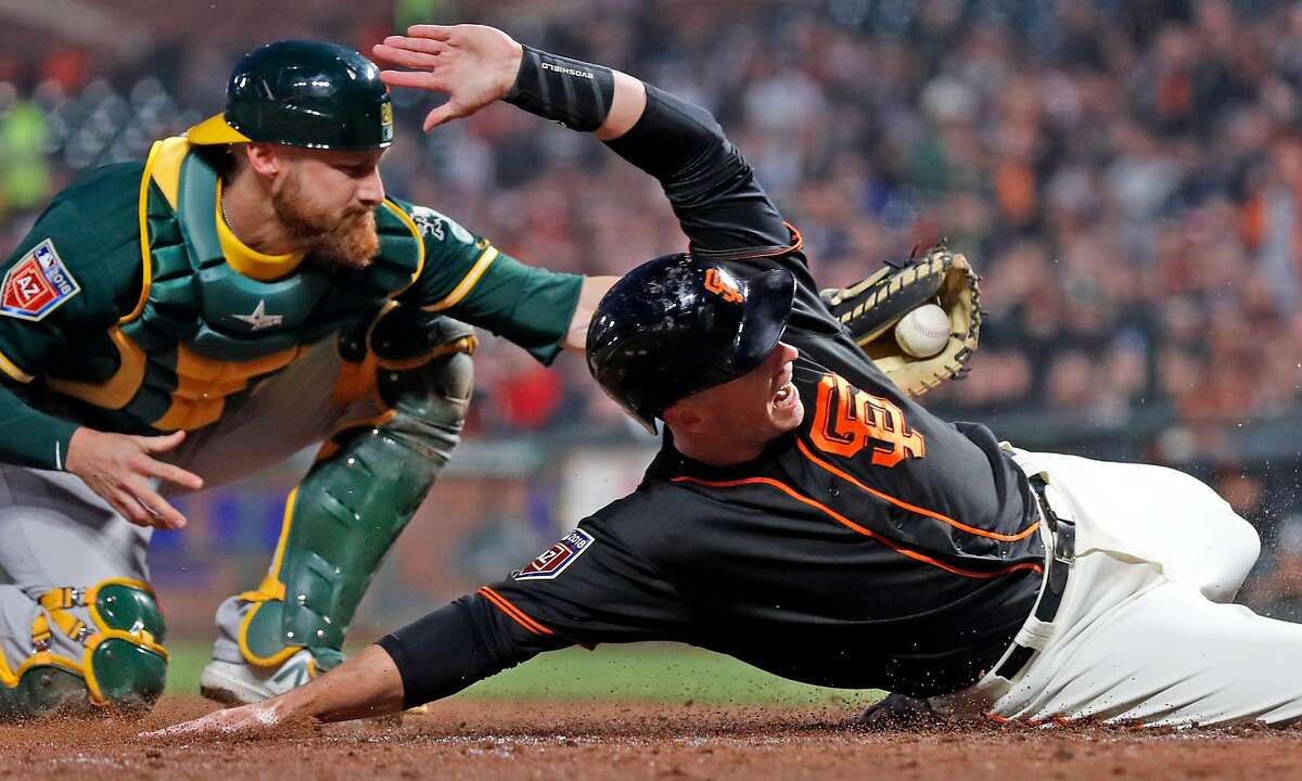 A's Jonathan Lucroy turns catching into art form