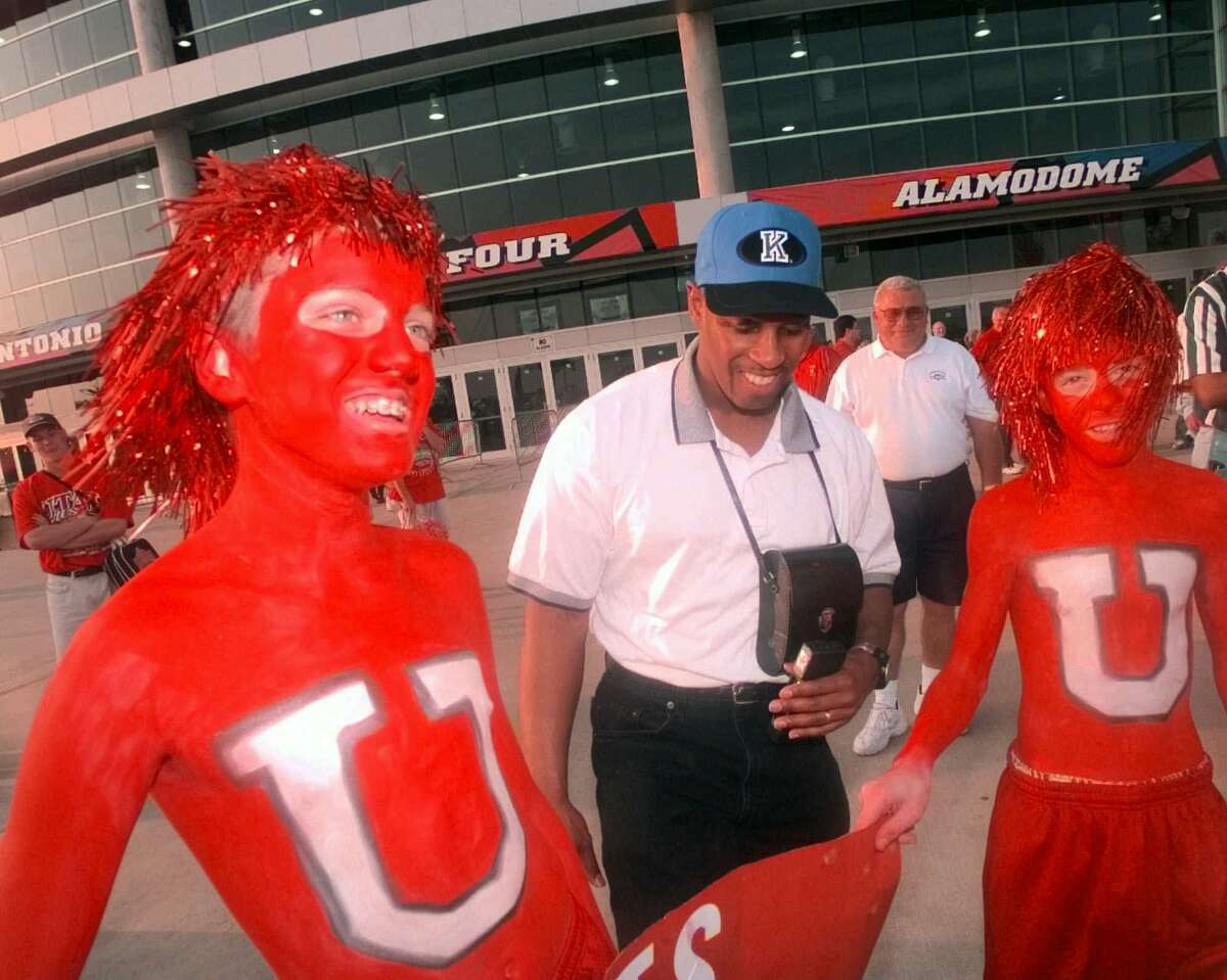Ryan Stam, 12, left, and C.J. Holt, 13, both of Park City, Utah, are shown with Kentucky fan Dayl McCllellan, of Evansville, Ind., outside the Alamodome in San Antonio, prior to the NCAA Men's Final Four Championship game on March 30, 1998.