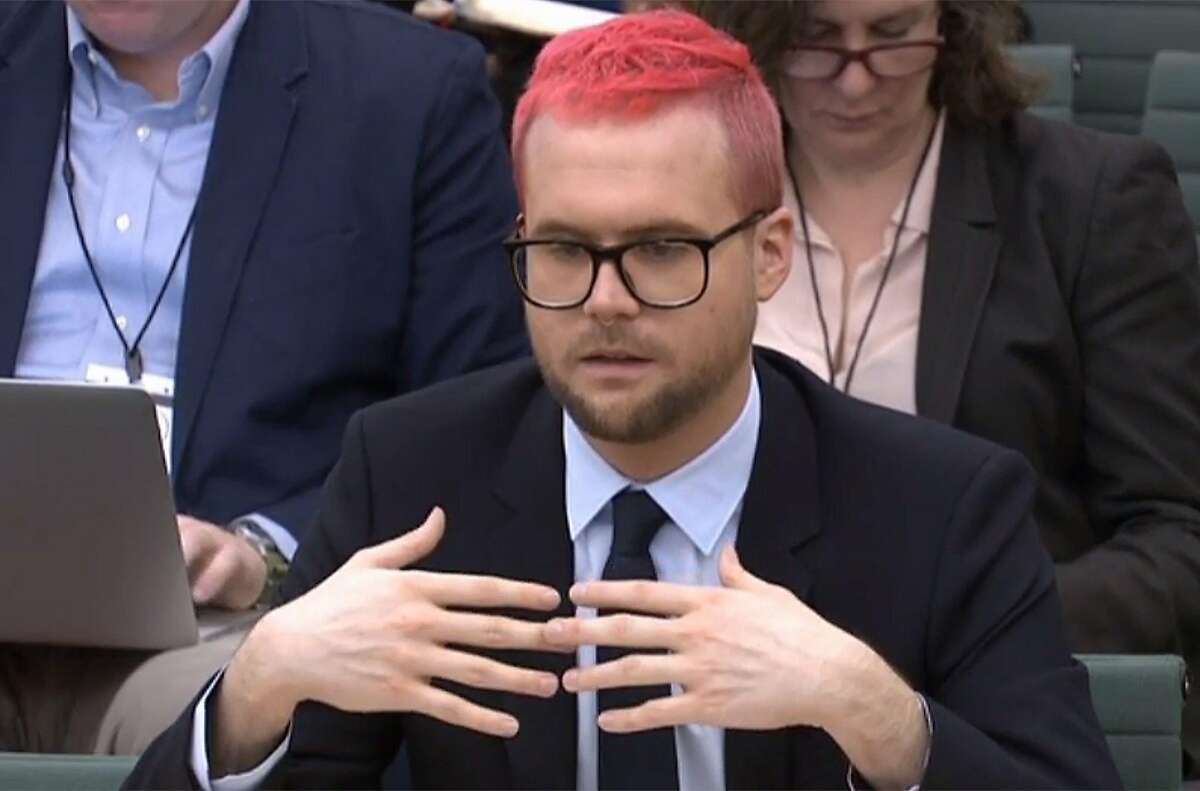 A video grab from footage broadcast by the UK Parliament's Parliamentary Recording Unit (PRU) shows Canadian data analytics expert Christopher Wylie who worked at Cambridge Analytica appears as a witness before the Digital, Culture, Media and Sport Committee of members of the British parliament at the Houses of Parliament in central London on March 27, 2018 as part of the committee's investigation into fake news. Cambridge Analytica, which worked on US President Donald Trump's election campaign, has been accused of illegally mining tens of millions of users' Facebook data and using it to target potential voters. Christopher Wylie, a 28-year-old Canadian data analytics expert who worked with Cambridge Analytica and Kogan, blew the whistle on the scandal by revealing that more than 50 million Facebook profiles had been accessed without approval. / AFP PHOTO / PRU AND AFP PHOTO / PRU / RESTRICTED TO EDITORIAL USE - MANDATORY CREDIT " AFP PHOTO / PRU " - NO USE FOR ENTERTAINMENT, SATIRICAL, MARKETING OR ADVERTISING CAMPAIGNSPRU/AFP/Getty Images