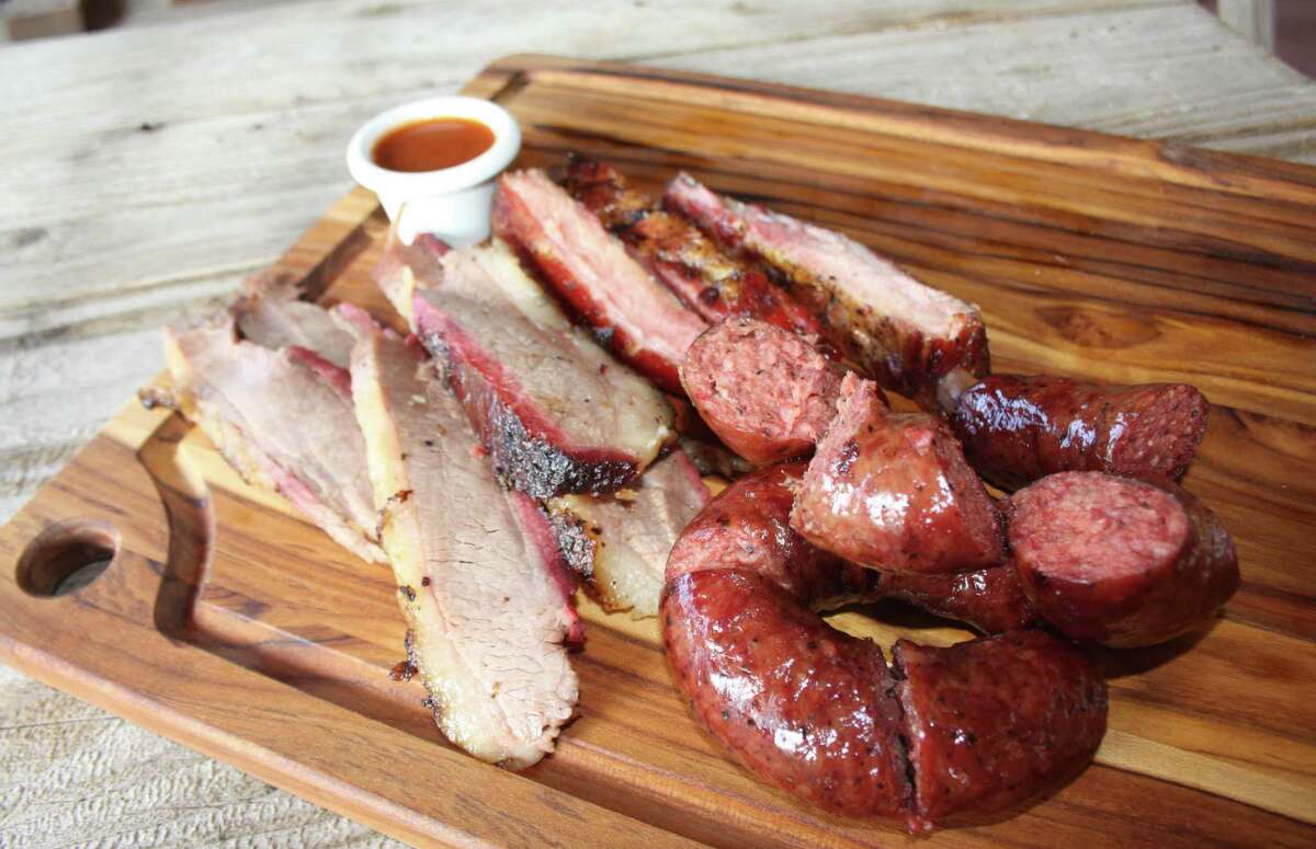 The Davila's BBQ trinity with brisket, ribs and beef sausage link.