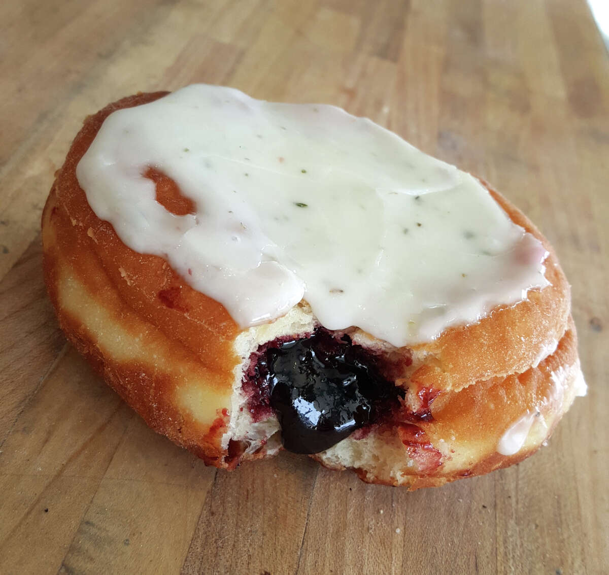 Blackberry jam lemon meyers donut made at Nomad Donuts in San Diego.