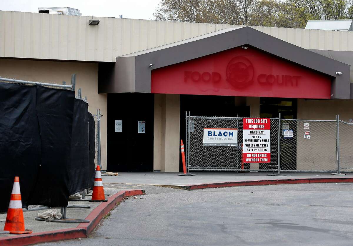 An entrance to the Food Court of the Vallco shopping mall is fenced off in Cupertino, Calif. on Wednesday, Feb. 14, 2018. Few tenants remain at the mall in the western Santa Clara Valley, including an AMC Theater and a couple of restaurants, but it is largely abandoned.