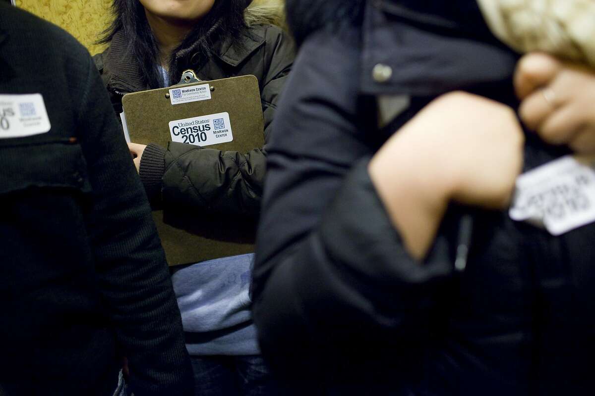 A Census Bureau member holds a clipboard with Census forms in New York on March 29, 2010. The 2020 census will ask respondents if they are U.S. citizens. Critics fear that the highly charged request by the Trump administration will result in a substantial undercount of the population because immigrants might not take part. 