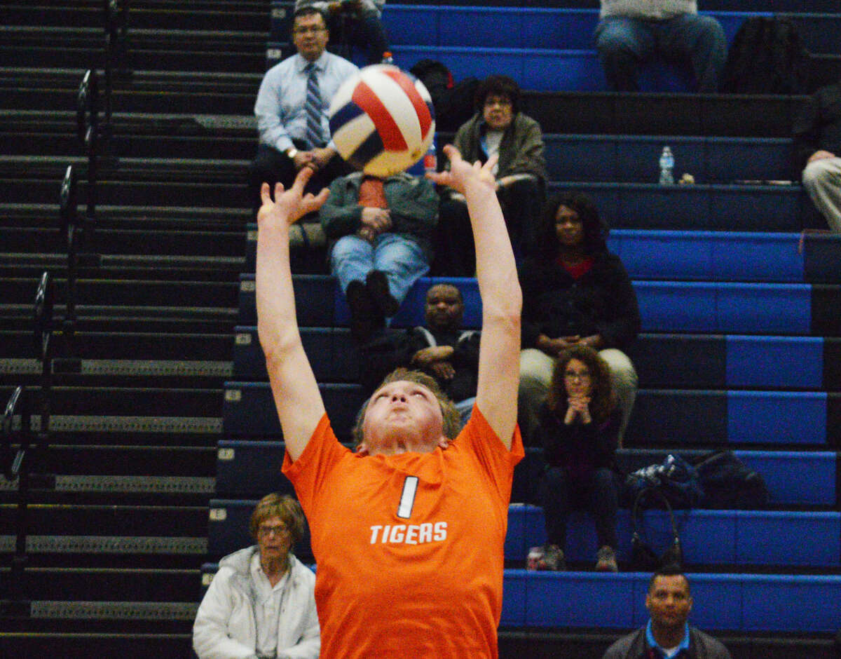 Edwardsville senior Lucas Verdun sets the ball during the second game of Tuesday’s Southwestern Conference match at Belleville East.