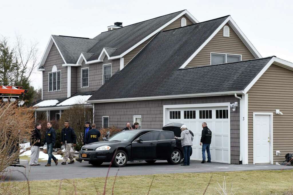 FBI and state police take computers and other evidence from the home of NXIVM co-founder Nancy Salzman which was raided by federal agents on Tuesday, March 27, 2018, in Halfmoon, N.Y. Keith Raniere, the co-founder of the NXIVM corporation has been arrested by the FBI based on a federal criminal complaint filed in the Eastern District of New York. (Will Waldron/Times Union) Photo: Will Waldron