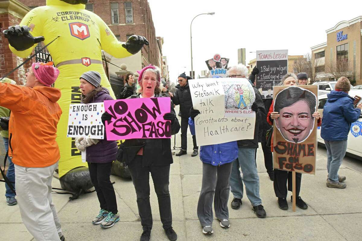 People show up to protest a fundraiser for John Faso and Elise Stefanik at the Fort Orange Club on Tuesday, March 27, 2018 in Albany, N.Y. (Lori Van Buren/Times Union)