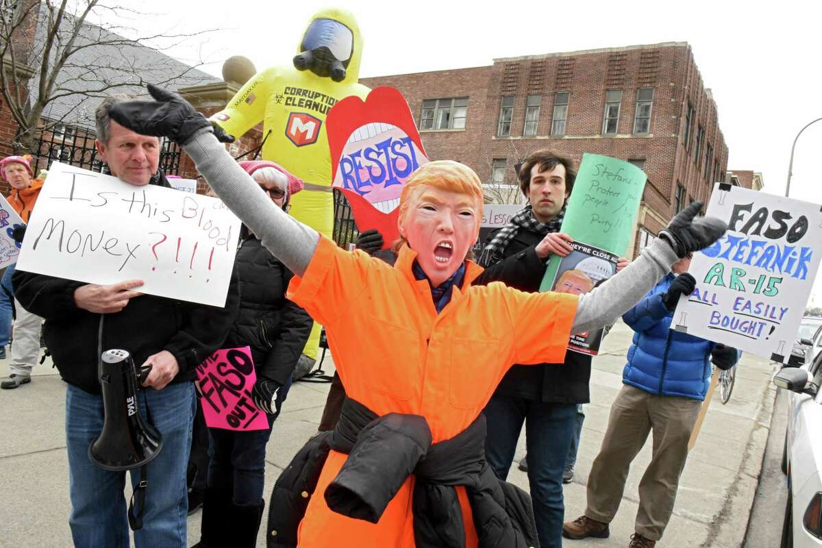 People show up to protest a fundraiser for John Faso and Elise Stefanik at the Fort Orange Club on Tuesday, March 27, 2018 in Albany, N.Y. (Lori Van Buren/Times Union)