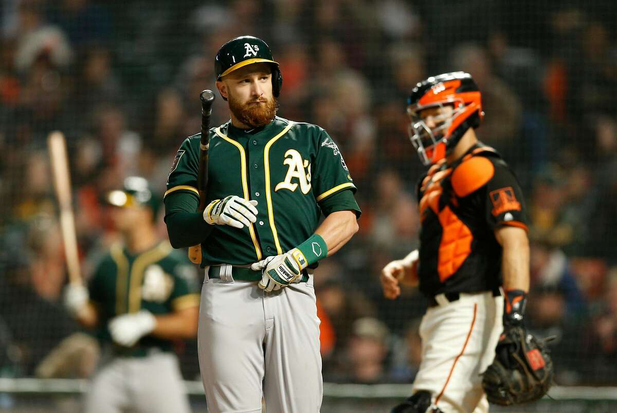 Oakland Athletics catcher Jonathan Lucroy (21) at bat during a Spring Training MLB game between the San Francisco Giants and Oakland Athletics at AT&T Park, Tuesday, March 27, 2018, in San Francisco, Calif.
