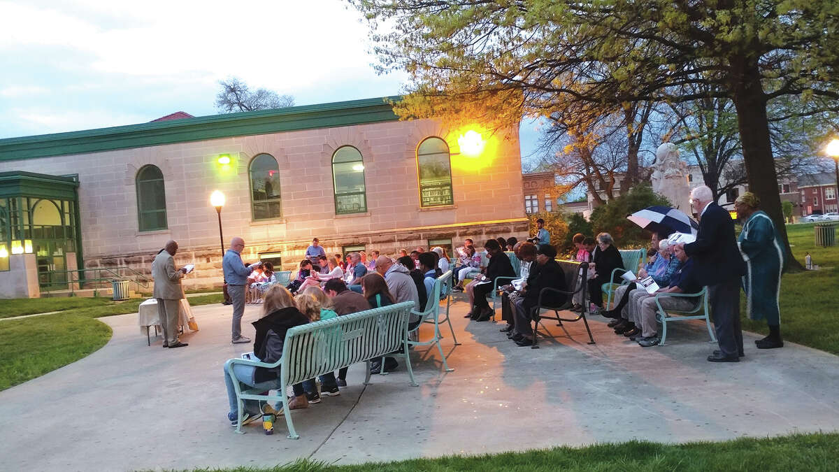Participants in last year’s Ecumenical Easter Sunrise Service gather at the bandstand at Edwardsville City Park.