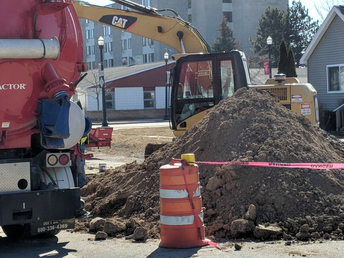 Beaverton Department of Public Works officials and Wards Excavators staff work on two area sinkholes. The deep holes on Brown and Saginaw streets are being repaired. DPW Supervisor Robert Sabisch said once filled, they will keep the areas closed, allowing the dirt and cement to pack in.