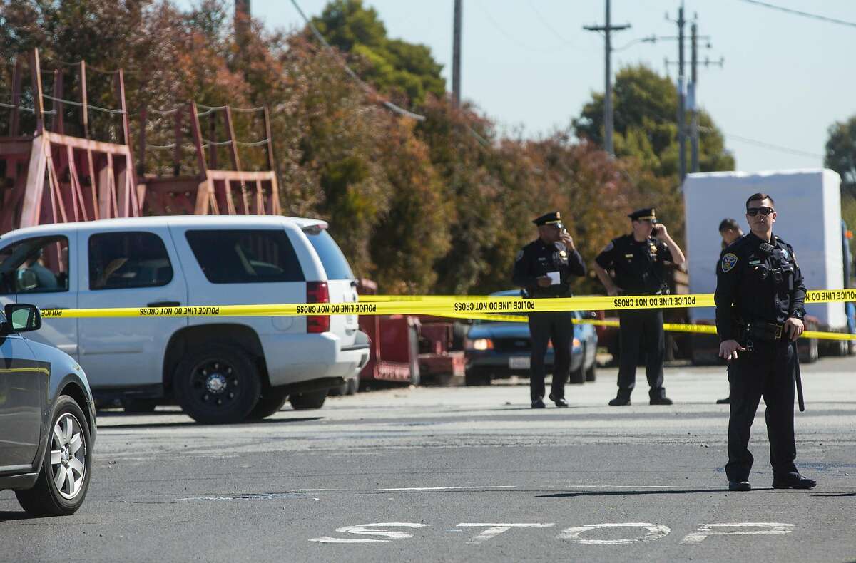 Officers work the scene following a hit-and-run incident that left four people with life-threatening injuries near 24th and Illinois streets Wednesday, March 28, 2018 in San Francisco, Calif.