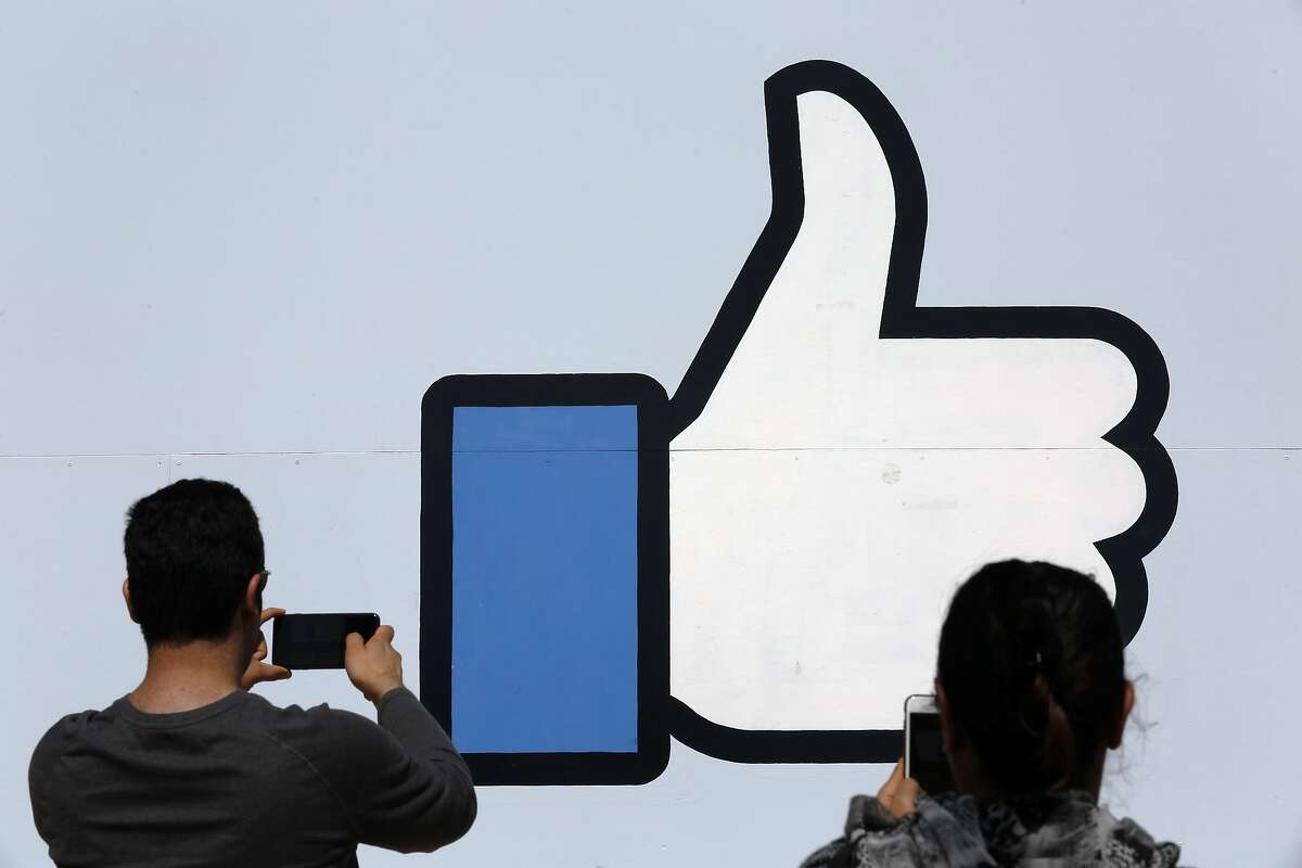 Vistors stop for photos at the famous Facebook sign in front of their headquarters at 1 Hacker way in Menlo Park, Calif. as seen on Tues. Mar. 27, 2018.