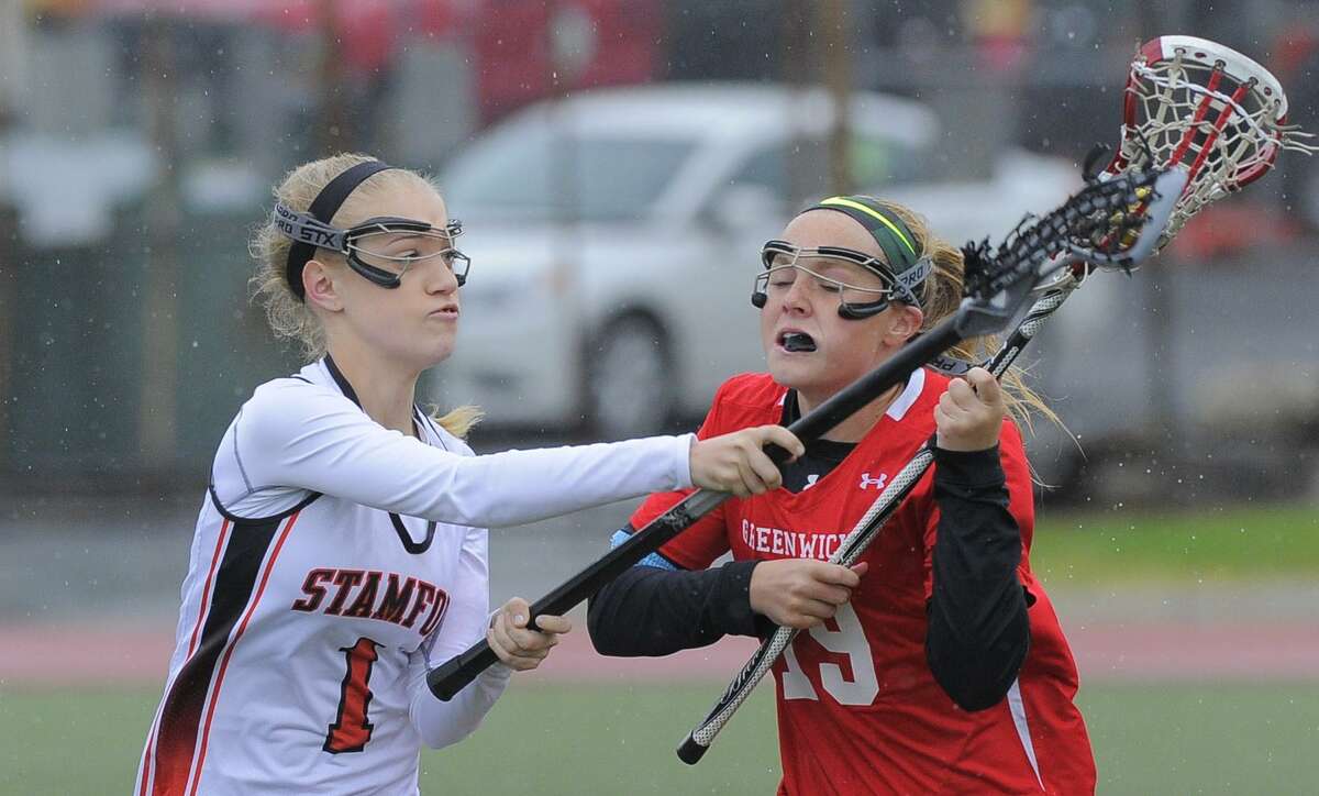 Stamford’;s Kelly Jagodzinski, left, is a sneiro cpatain for the Black Knights.