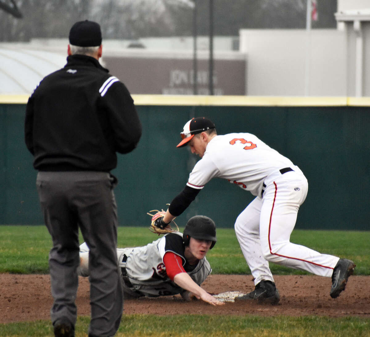Edwardsville infielder Jack Cooper applies a tag to a Granite City baserunner during the second inning of Wednesday’s game.