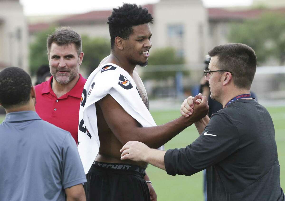 Marcus Davenport is congratulated by NFL scouts and coaches after he goes through drills for NFL scouts during the UTSA Pro Day at the school on March 28, 2018.