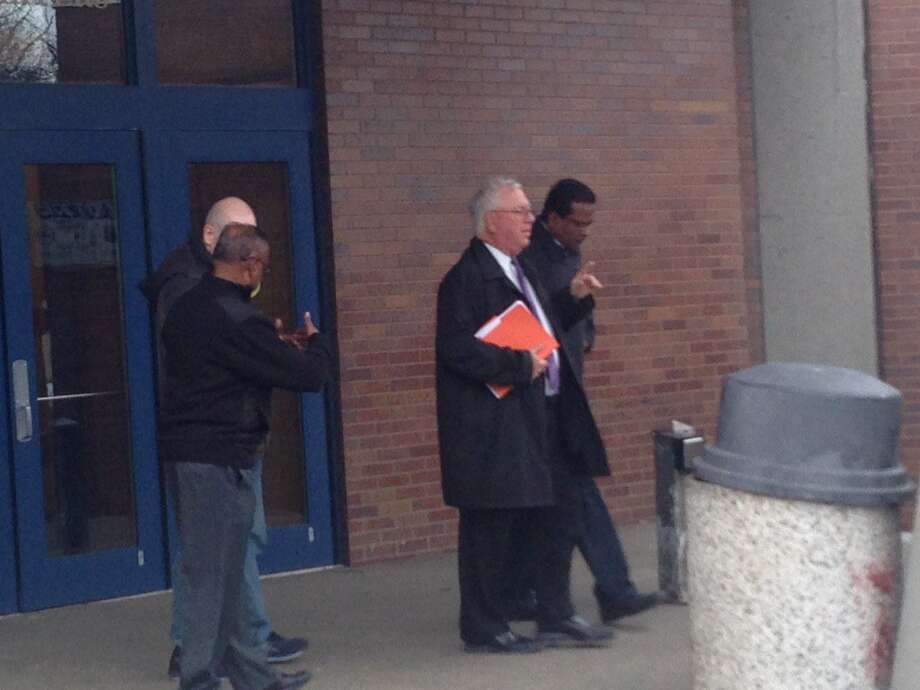 Schenectady City Council member John Mootooveren, right, and his attorney, Steven X. Kouray leave court after Mootooveren was arraigned on a harassment charge that accused him of throwing a drink at another man. Photo: Paul Nelson / Times Union