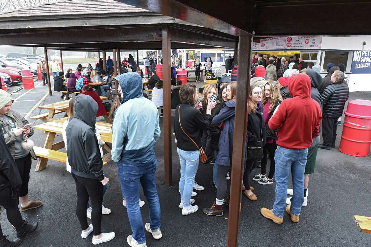 A little rain doesn't stop Jumpin' Jack's from drawing a large crowd on their season opening day on Thursday, March 29, 2018 in Scotia N.Y. (Lori Van Buren/Times Union)