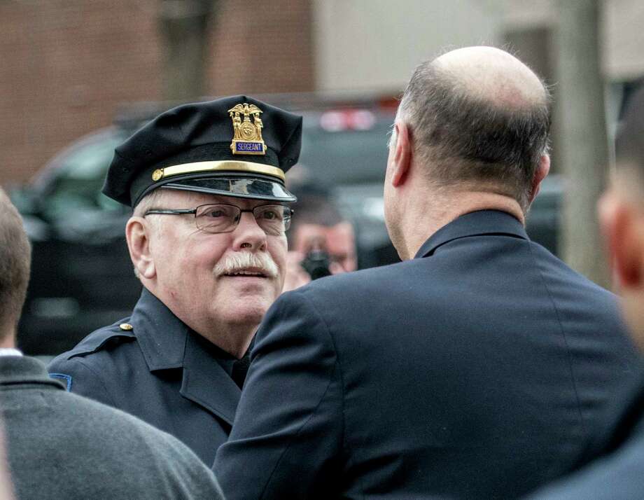 D/Sgt. Mike Parrow speaks with Rensselaer County Sheriff Pat Ruso, right, during his retirement ceremony at Central Station Thursday March 29, 2018 in Troy, N.Y.  (Skip Dickstein/Times Union) Photo: SKIP DICKSTEIN, Albany Times Union / 20043346A
