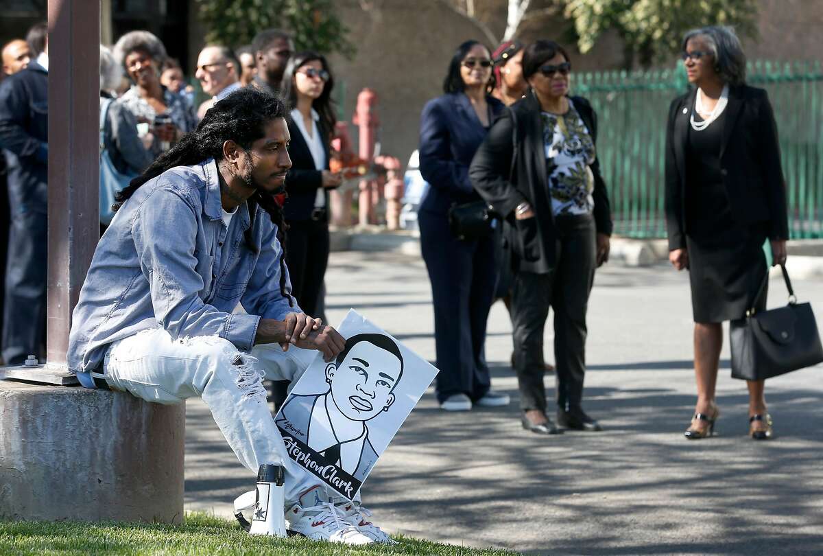 Steven Ash waits with other mourners to attend the funeral service for his friend Stephon Clark in Sacramento, Calif. on Thursday, March 29, 2018. Clark was shot and killed in the backyard of his grandmother's home by police officers who mistook a cellphone he was holding for a gun.