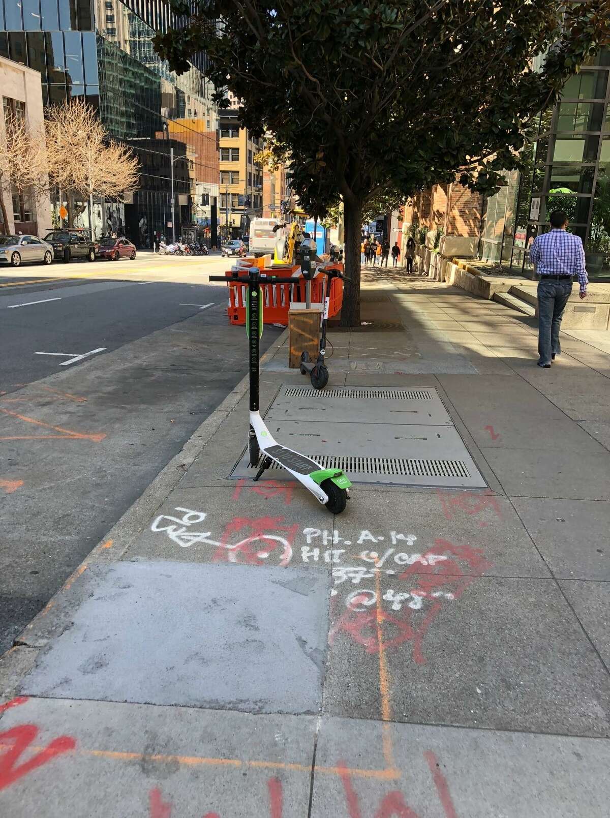 A LimeBike e-scooter on a South of Market sidewalk.