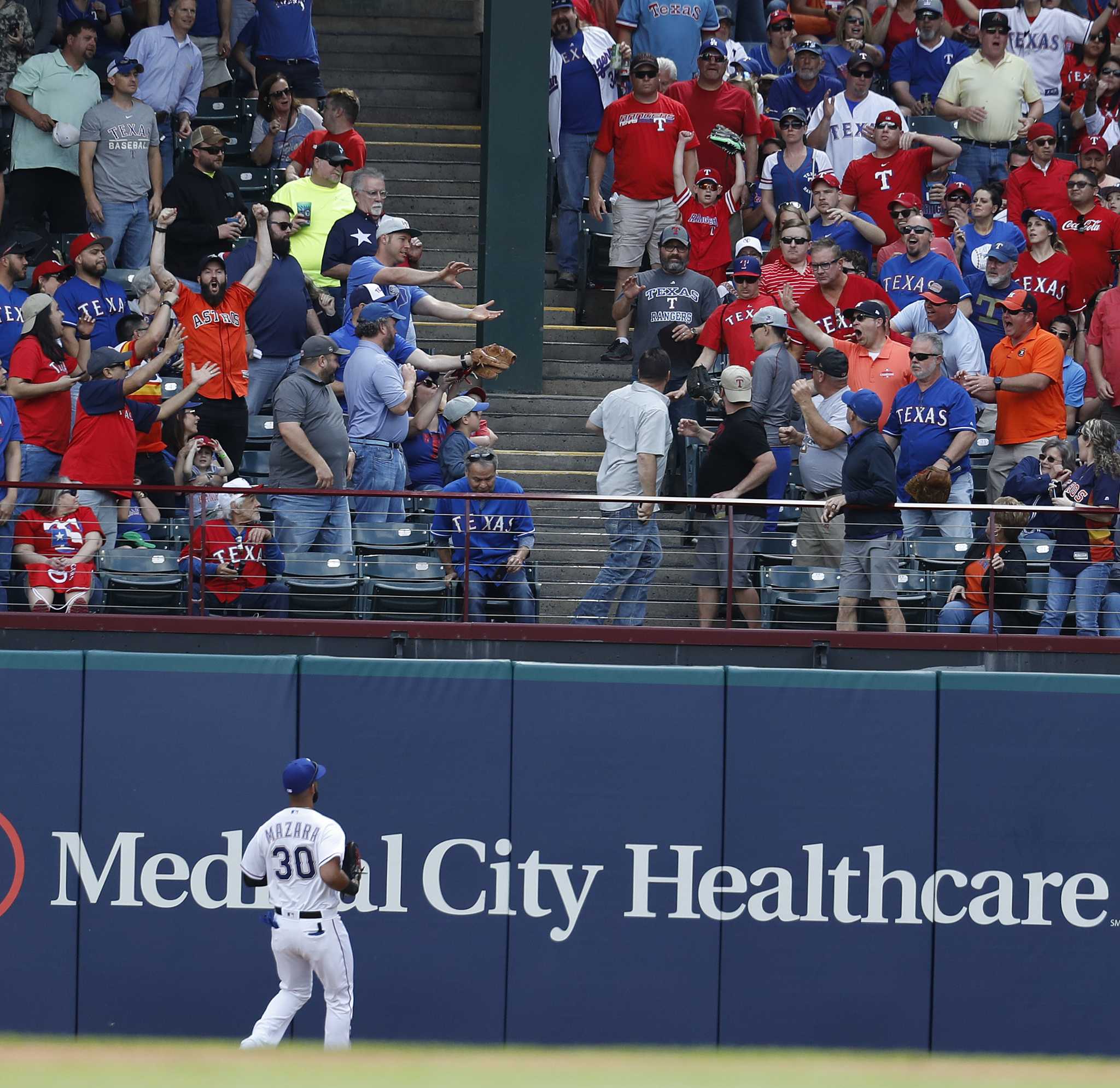 Texas Rangers shortstop Elvis Andrus (1) leaps over Houston Astros