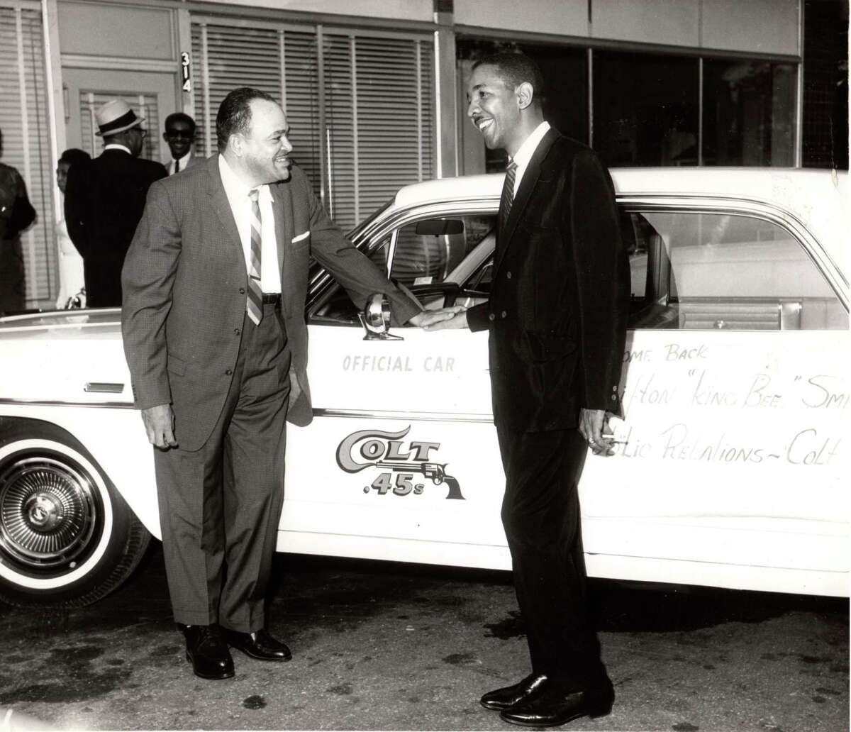 Houston jazz great Arnett Cobb, left, pictured in 1963 with the Houston Colt .45s car.