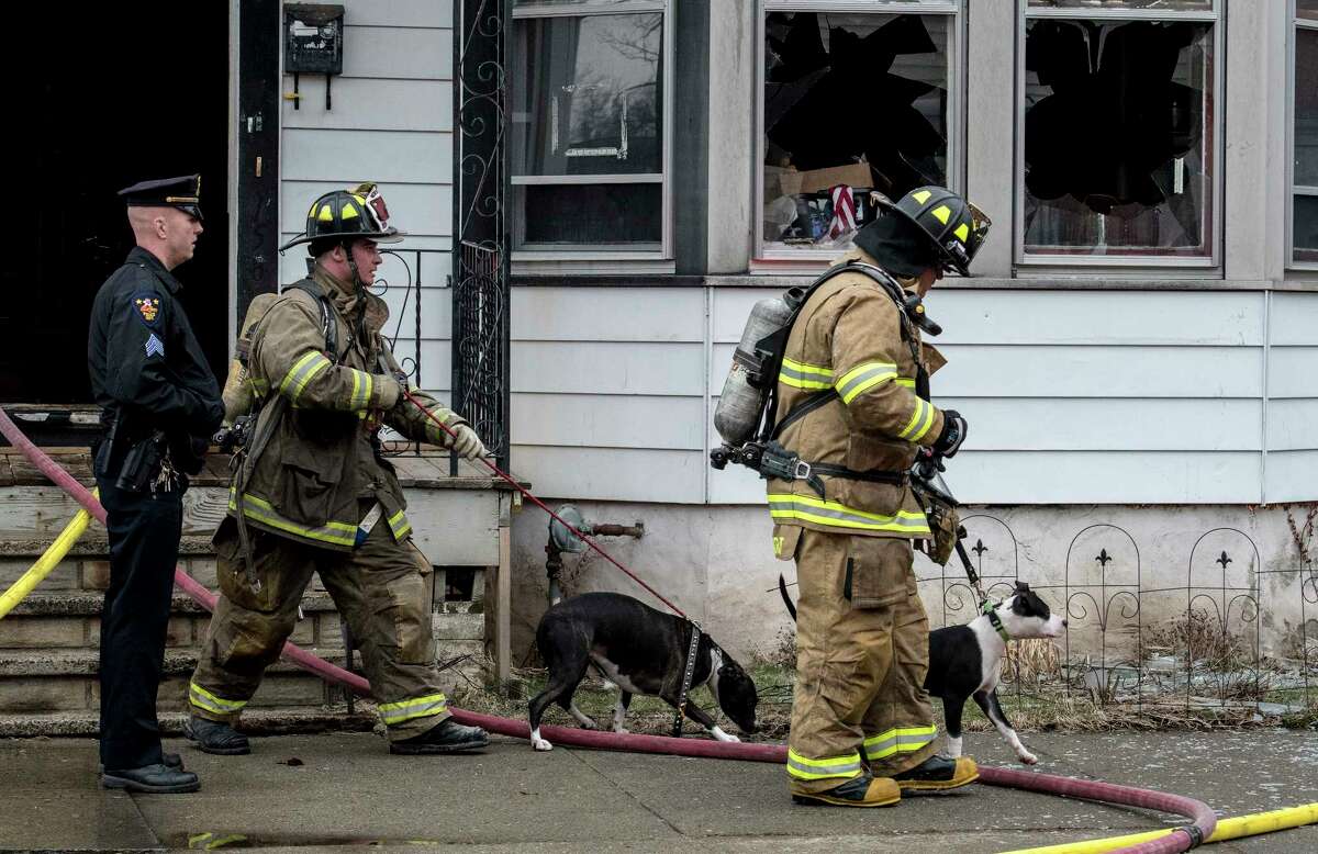 Deputy Chief Eric McMahon looks for extension at the scene of a two-alarm fire at 158 6th Avenue Thursday March 29, 2018 in Troy, N.Y. A number of house pets were saved and a few were lost in the smokey blaze. (Skip Dickstein/Times Union)