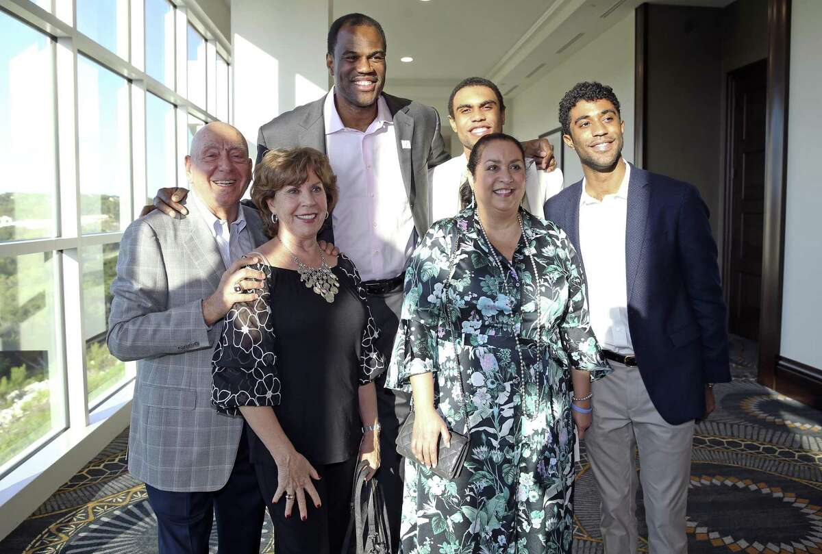 David Robinson gathers his family — sons Cory and David with wife Valerie — for a photo with Dick Vitale and wife Lorraine on Thursday.