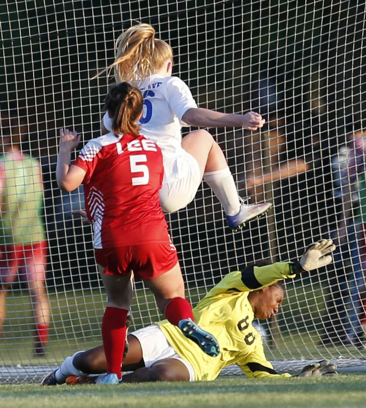 Lee's Mariah Scott stop the score by Westlake's Addie Hackney but later she scored on a penalty kick.Lee v Austin Westlake from the Class 6A bidistrict high school girls soccer playoff on Thursday, March 29 ,2018