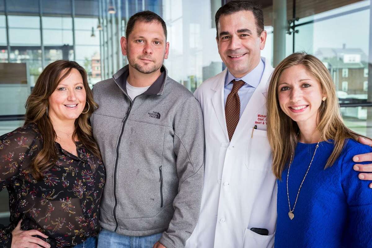 Andrea Rogers, Tim Scaggs, Dr. Michael Coady and Rachel Kornfeld stand for a photo at Stamford Hospital. Rogers, Scaggs and Kornfeld all underwent open-heart surgeries in the past year and, with Dr. Coady’s help, have since become freinds.