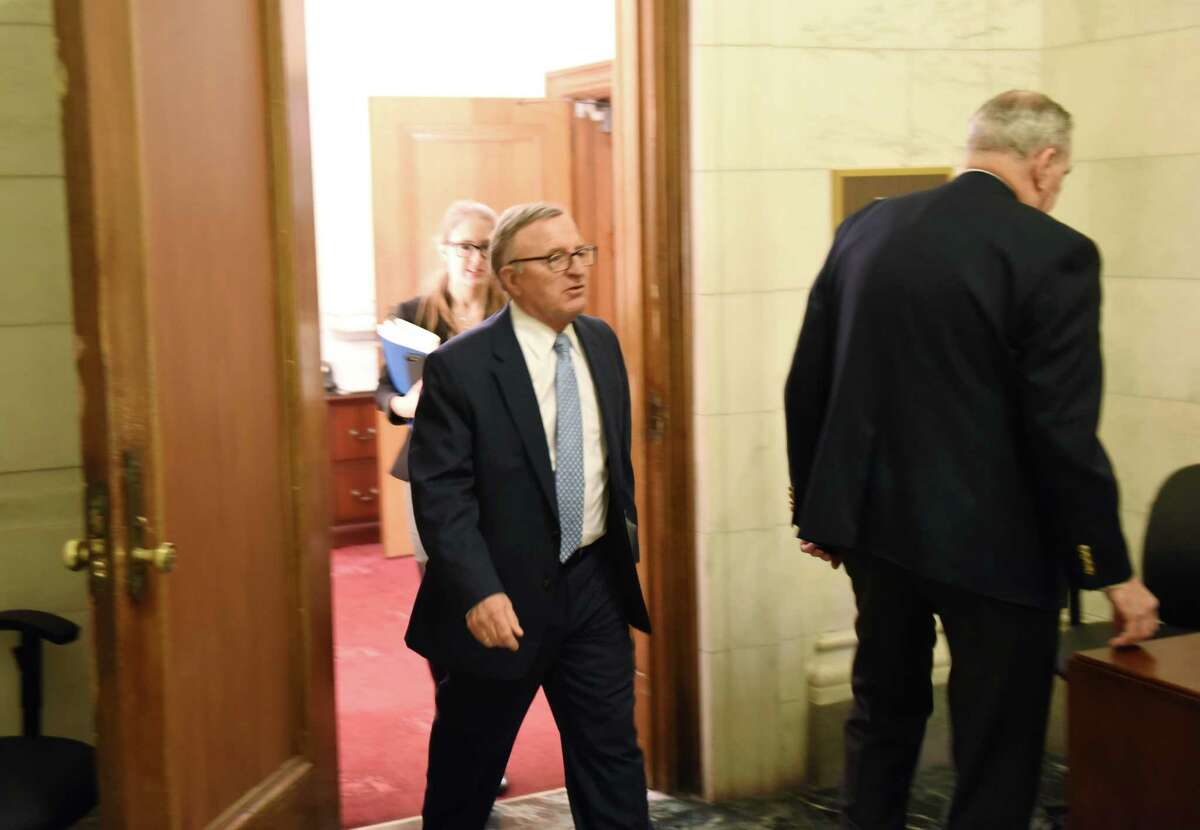 Sen. John DeFrancisco leaves Majority Leader John Flanagan's office on Friday morning, March 30, 2018, at the Capitol in Albany, N.Y. (Will Waldron/Times Union)