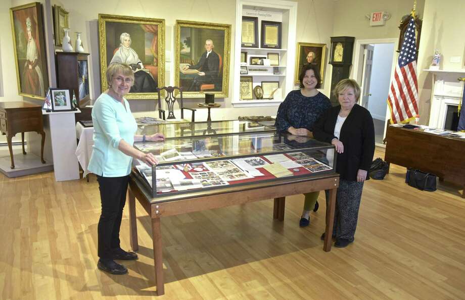 The Roger Sherman Chapter, Daughters of the American Revolution which is  celebrating its 125th anniversary with an exhibit at the New Milford Historical Society. Mary Schenzer, Chapter Historian, left, Bonnie Butcher, Regent, right, and New Milford Historical Society Curator Lisa Rousch, center, stand in the exhibit. Thursday, March 29, 2018, in New Milford, Conn. Photo: H John Voorhees III / Hearst Connecticut Media / The News-Times