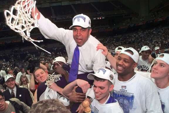 Kentucky Coach Tubby Smith is carried off the court by game MVP Jeff Sheppard, left, Steve Masiello, center right, and Myron Anthony, second right, at the Alamodome in San Antonio Monday, March 30, 1998. Other players, cheerleaders and fans surround. (AP Photo/Eric Draper)