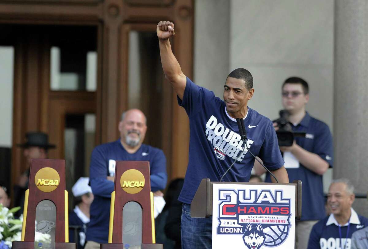 Connecticut men's basketball coach Kevin Ollie gestures during a celebration of UConn's championships in the NCAA men's and women's tournaments, at a rally at the State Capitol in Hartford, Conn., on Sunday, April 13, 2014. (AP Photo/Fred Beckham)