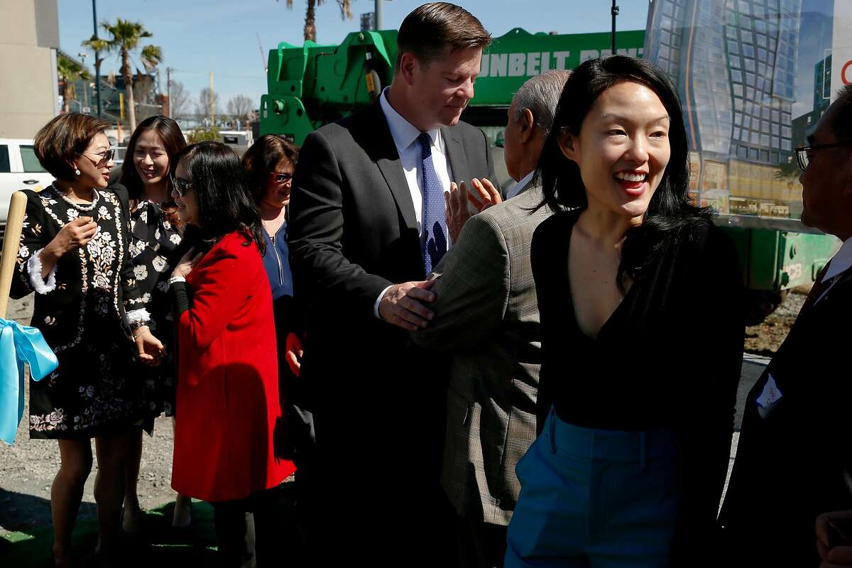 Anita Lee (in red), Mayor Mark Farrell (center) and Supervisor Jane Kim (right) at the site of construction for the Marriott SOMA Mission Bay Hotel, located at 100 Channel St., Thursday, March 29, 2018, in San Francisco, Calif.