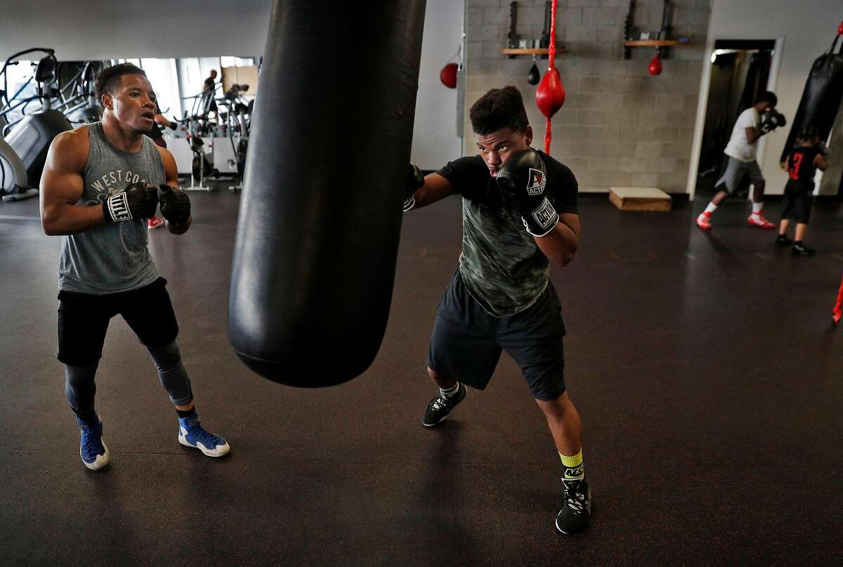 Karim Mayfield works out with Keshon Wilson, right, at the 3rd Street Boxing Gym in San Francisco, Calif., on Wednesday, March 28, 2018. Mayfield is the formerly ranked #3 welterweight boxer in the world, and has started a boxing promotion company and is training for his next fight in April. Karim is coming off of a win last October at the historic San Francisco Armory and since that fight, Karim has been heavily involved in the social/political movements that are protesting the death of his brother, who was recently shot by a Bart police officer.